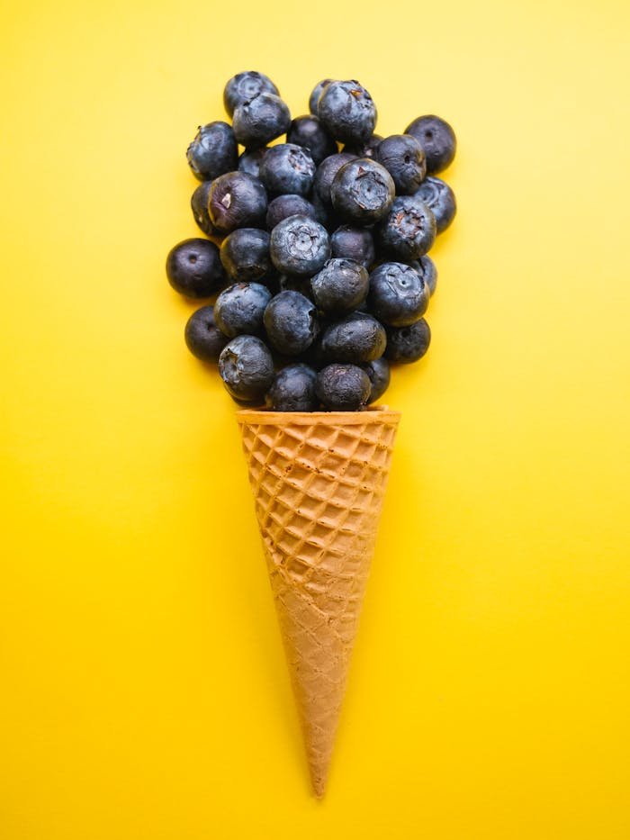 Blue Berries on Brown Ice Cream Cone
